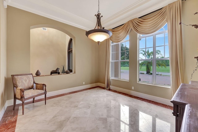 living area featuring crown molding