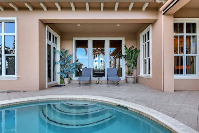 view of pool featuring a patio