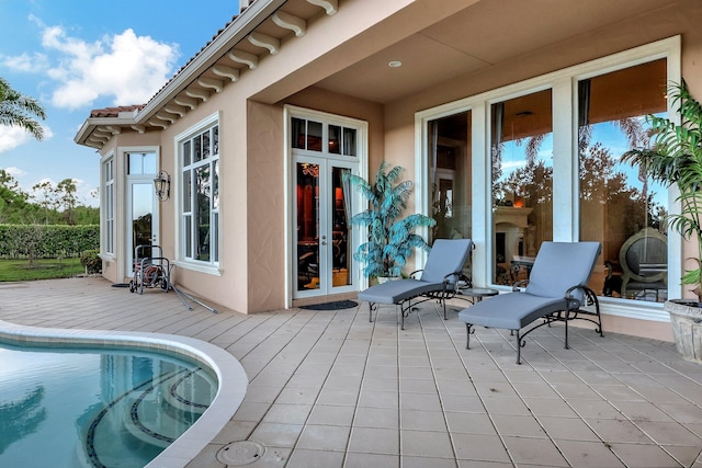 exterior space featuring french doors and a deck