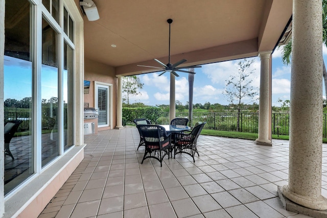 view of patio featuring a grill and ceiling fan