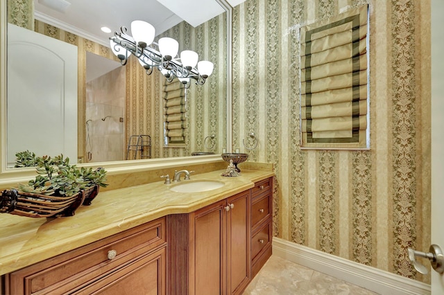 bathroom featuring vanity, tile patterned flooring, and crown molding