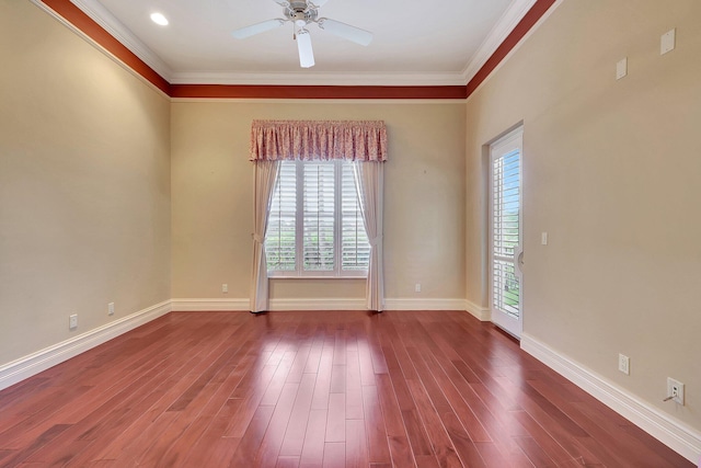 unfurnished room with plenty of natural light, hardwood / wood-style flooring, and crown molding