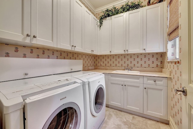 laundry area with washing machine and dryer, cabinets, sink, and light tile patterned floors