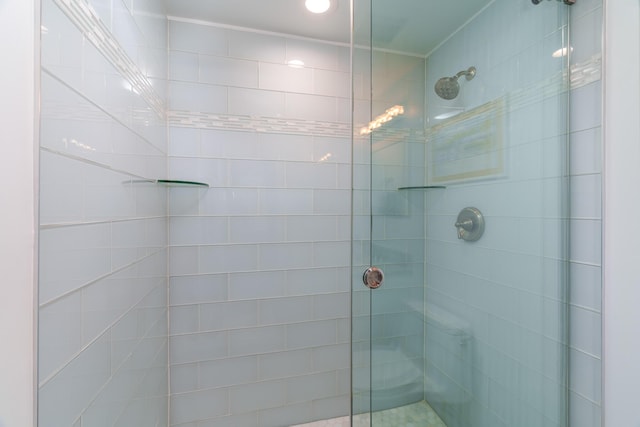 bathroom with a shower with shower door