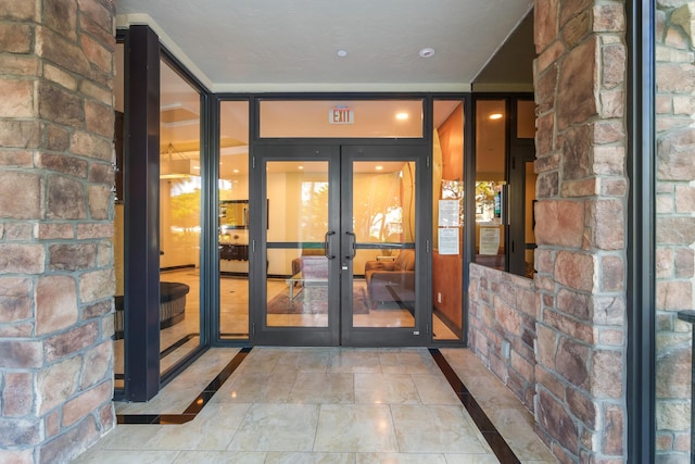 property entrance featuring french doors