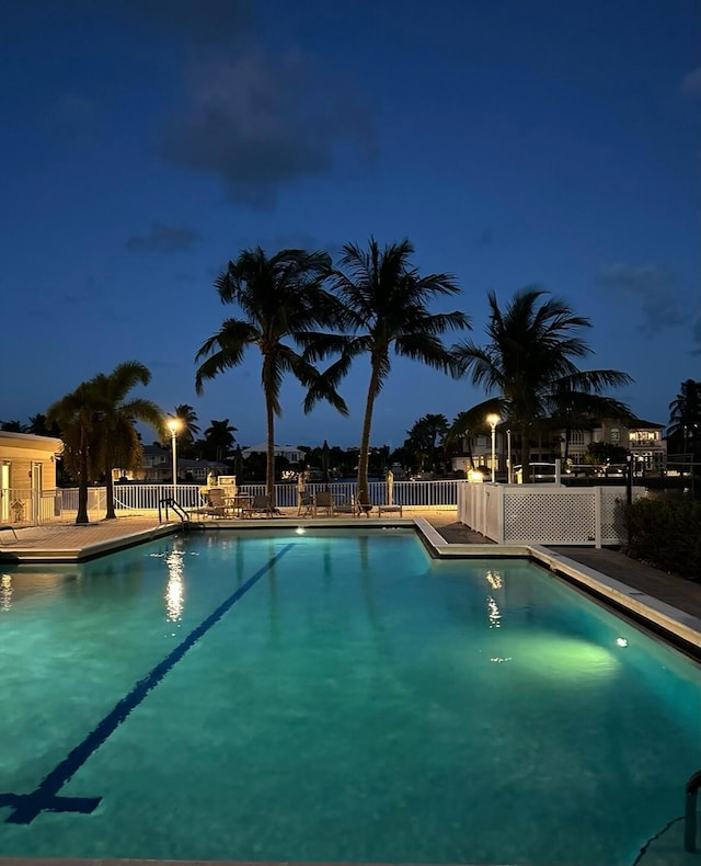 view of pool at night