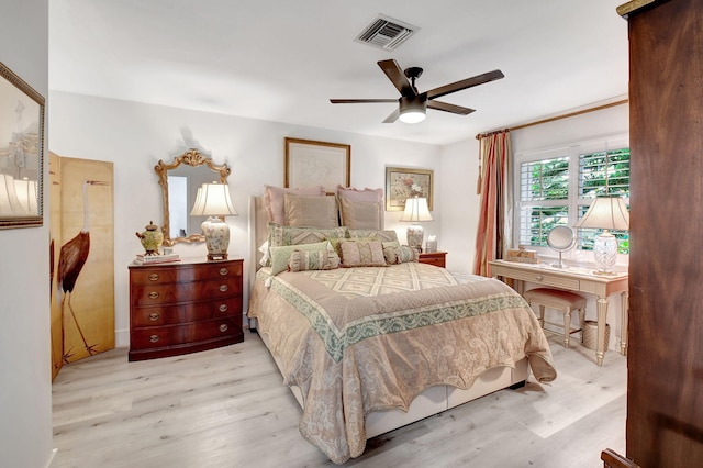 bedroom with light hardwood / wood-style floors and ceiling fan