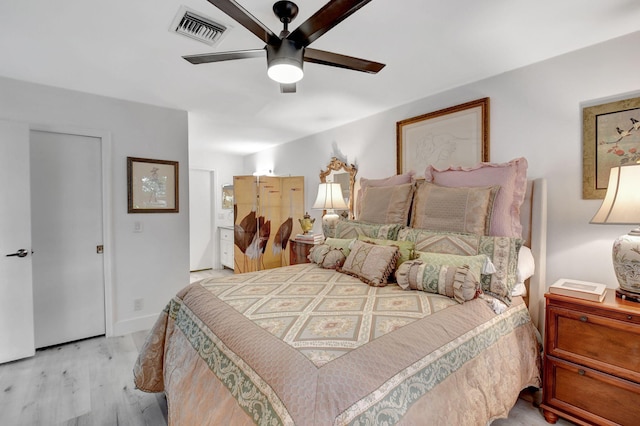 bedroom featuring light hardwood / wood-style flooring and ceiling fan