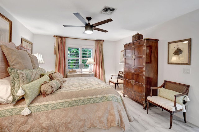 bedroom featuring light wood-type flooring and ceiling fan