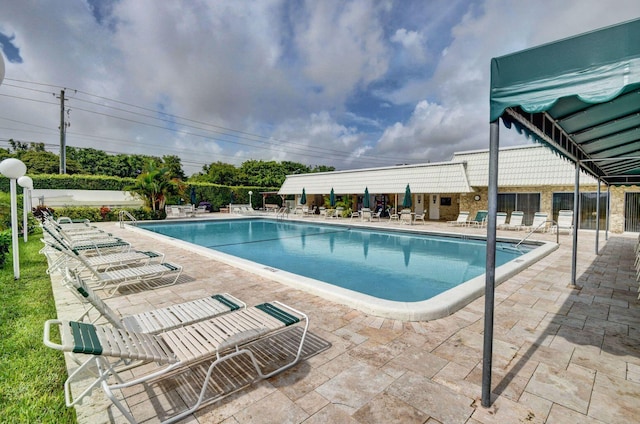 view of swimming pool featuring a patio area