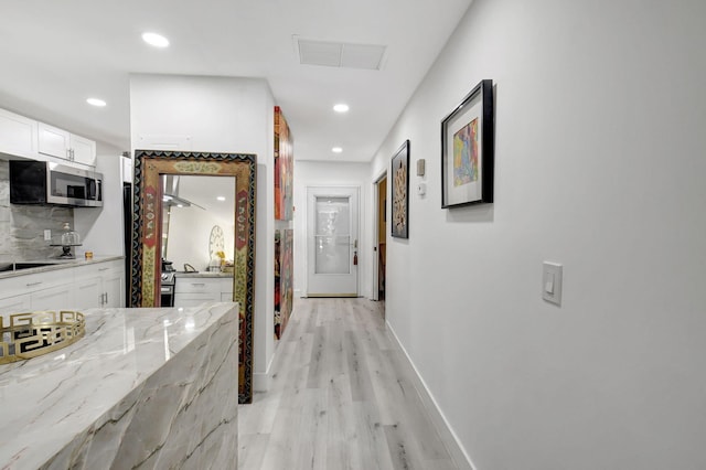 hallway featuring light wood-type flooring