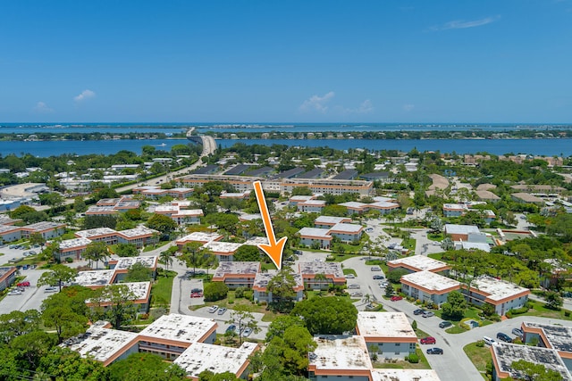 birds eye view of property featuring a water view