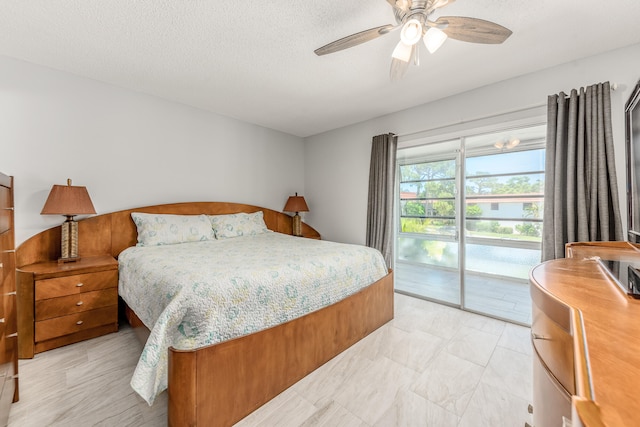 bedroom with light tile patterned flooring, a textured ceiling, access to exterior, and ceiling fan