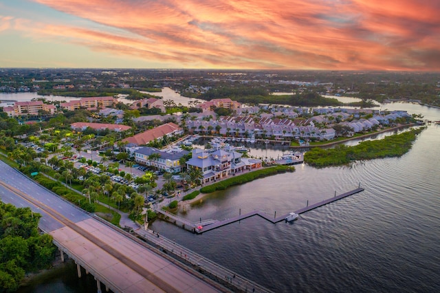 aerial view at dusk with a water view