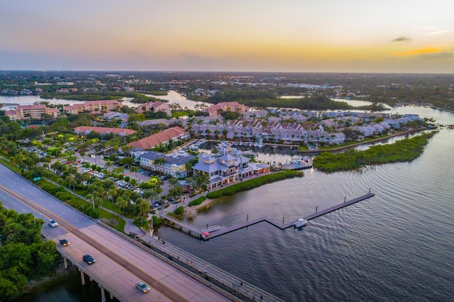 aerial view at dusk with a water view