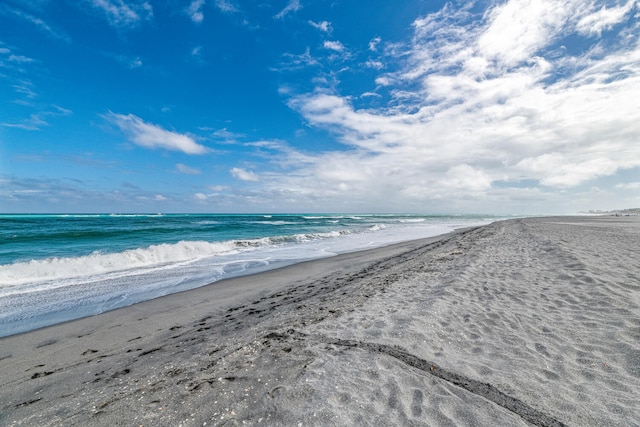 property view of water featuring a beach view