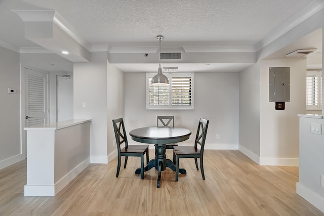 dining area featuring crown molding, electric panel, light hardwood / wood-style flooring, and a textured ceiling