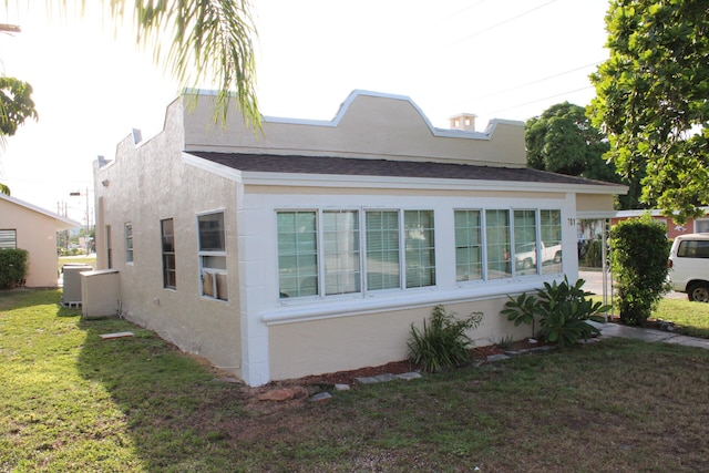 view of home's exterior with a yard