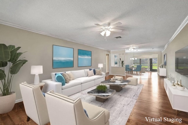 living room featuring ceiling fan, hardwood / wood-style flooring, crown molding, and a textured ceiling