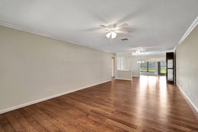 empty room featuring ceiling fan, ornamental molding, a textured ceiling, and dark hardwood / wood-style flooring