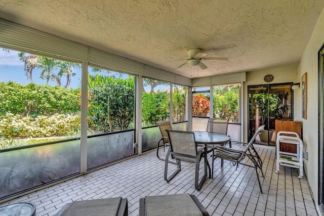 sunroom / solarium with ceiling fan