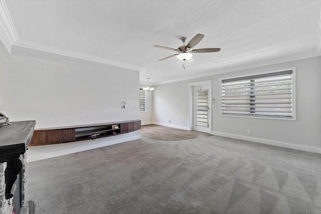 unfurnished living room with a textured ceiling, ceiling fan, ornamental molding, and light carpet