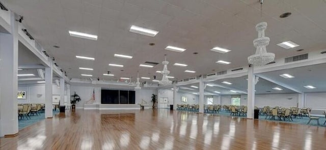 workout room with wood-type flooring