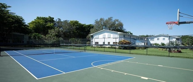 view of sport court featuring tennis court