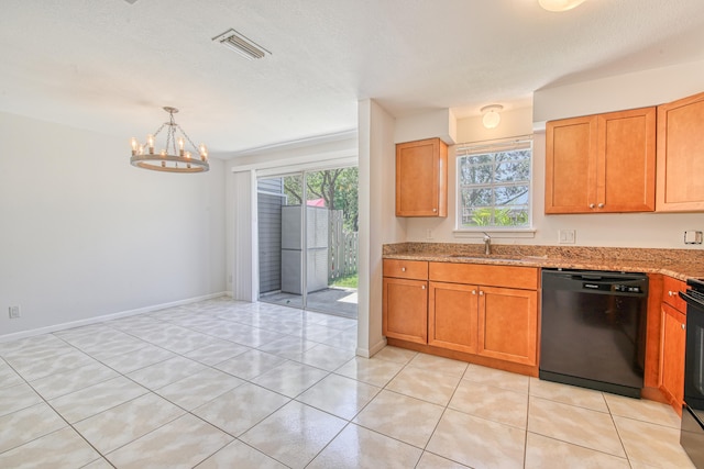 kitchen with plenty of natural light, light stone countertops, black appliances, and light tile patterned floors