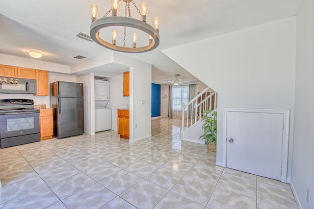 kitchen with ceiling fan with notable chandelier, black appliances, and light tile patterned floors