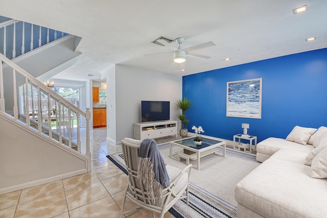 tiled living room featuring ceiling fan