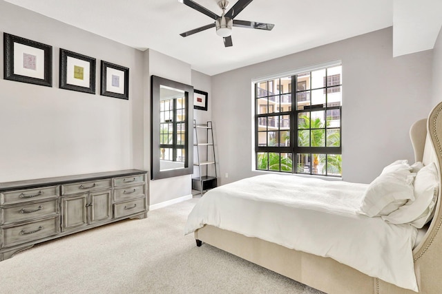 bedroom with light colored carpet and ceiling fan