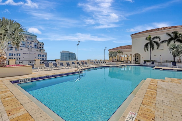 view of swimming pool featuring a patio area