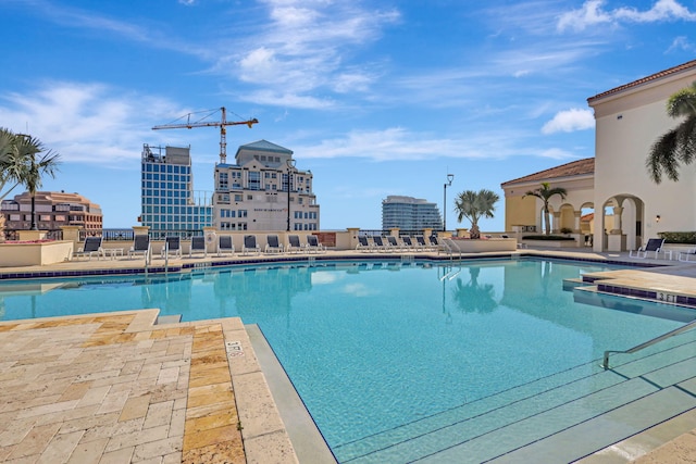 view of swimming pool with a patio area