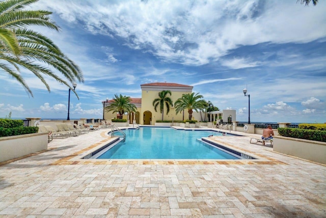 view of swimming pool with a patio area