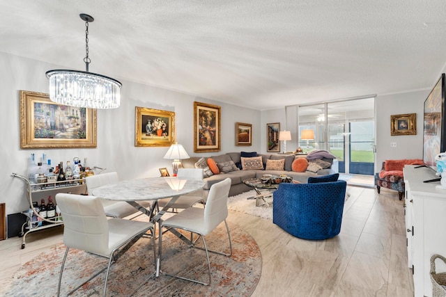 dining room with a textured ceiling, light tile patterned floors, and a chandelier