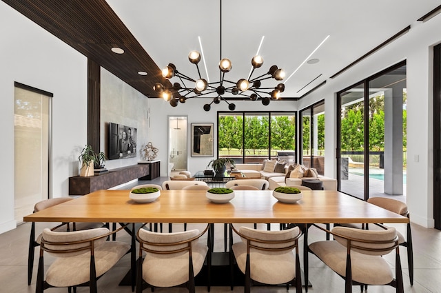 dining space with an inviting chandelier