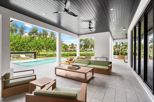 view of patio / terrace featuring ceiling fan, a fenced in pool, and outdoor lounge area