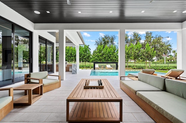 view of patio featuring outdoor lounge area and a fenced in pool