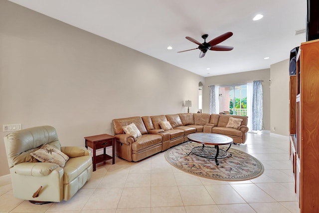 living room with ceiling fan and light tile patterned flooring