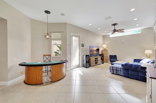 living room with ceiling fan and light tile patterned floors