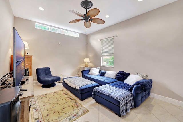 tiled living room with ceiling fan