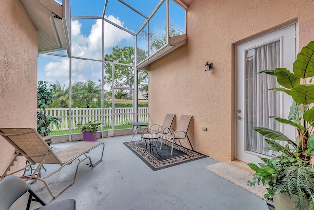 view of patio / terrace with glass enclosure