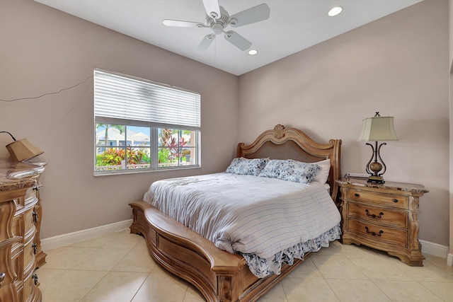 tiled bedroom featuring ceiling fan