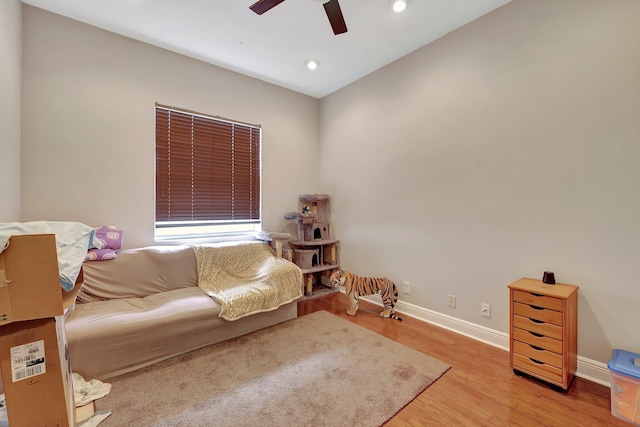 sitting room featuring ceiling fan and light hardwood / wood-style floors