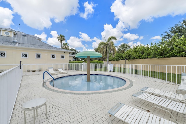 view of pool featuring a patio