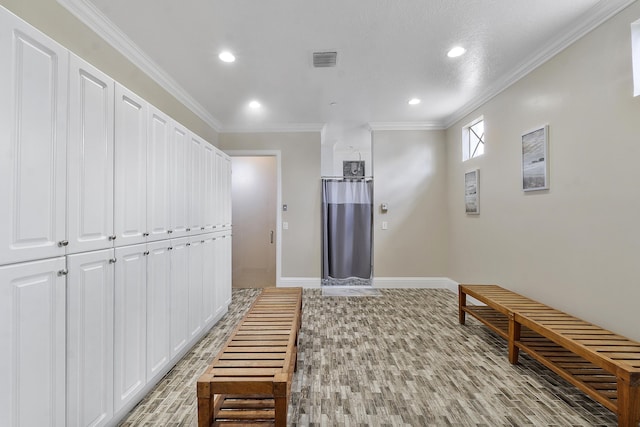 hallway featuring crown molding