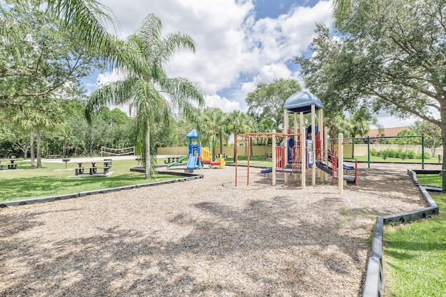 view of jungle gym featuring a lawn