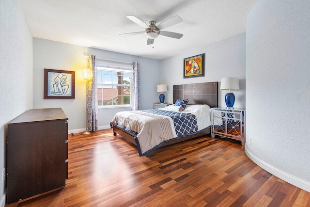 bedroom featuring wood-type flooring and ceiling fan