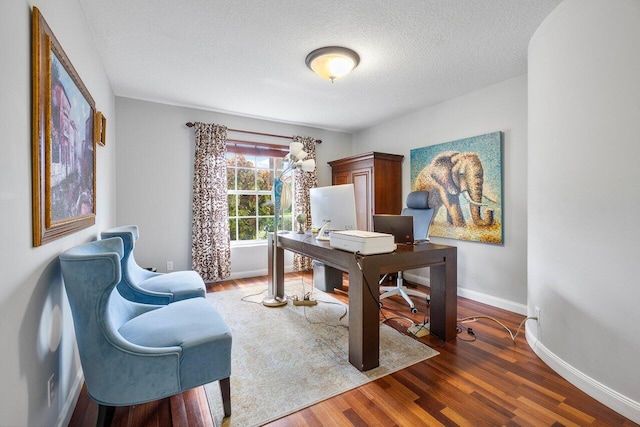 office featuring dark hardwood / wood-style floors and a textured ceiling